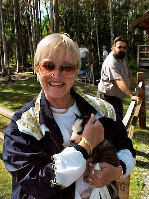 Audrey DeLange With Iditerod Sled Dog Puppy. Alaska Travels & Tours Pictures, Photos, Images, & Reviews.