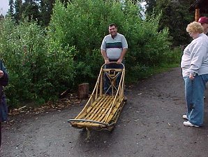 George DeLange Tries Out The Dog Sled. Palmer To Denali Alaska. Travels & Tours Pictures, Photos, Images, & Reviews.