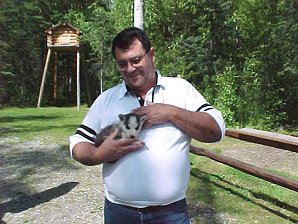 George DeLange Wants The Puppy. Iditarod Sled Museum, Wasilla, Alaska. Travels & Tours Pictures, Photos, Images, & Reviews.