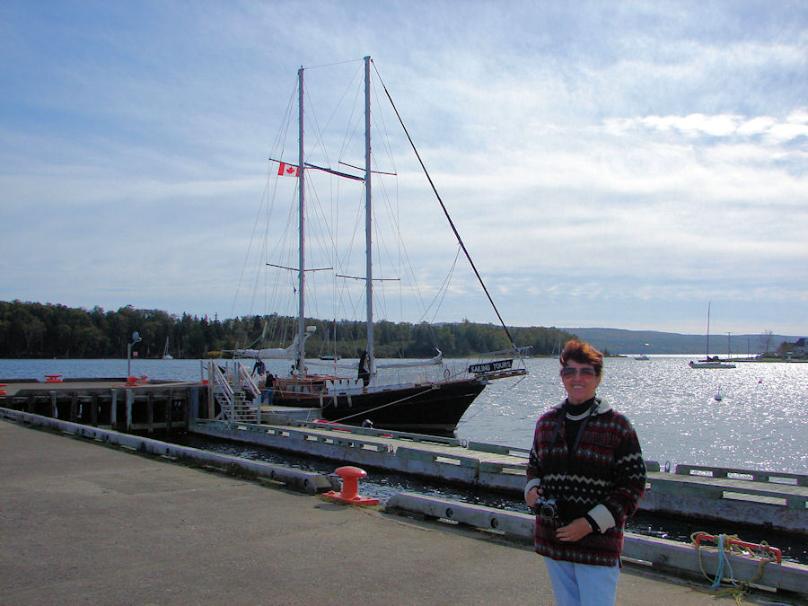 Eve DeLange Preparing To Board The 'Amoeba' To Sail The Bras D'or Lakes at Baddeck, Nova Scotia with Amoeba Sailing Tours. Travels, Tours, Photos, Pictures, Images, Information, & Reviews.