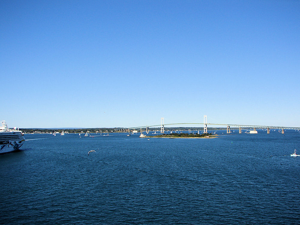 View Of Claiborne Pell Bridge, Commonly Known As The Newport Bridge. Rose Island & Rose Island Lighthouse In Foreground. Newport Harbor, Newport, Rhode Island, United States. Travel, Tours Photos, Pictures, Information, & Reviews.