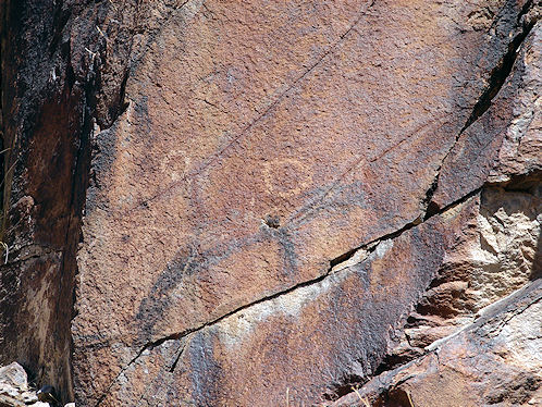 Petroglyph Below Third Waterfall. At Sloan Canyon Petroglyph Site Near Las Vegas & Henderson, Nevada, In The Northwestern McCullough Mountain Range. Travel & Tour Pictures, Photos, Images, Information & Reviews.
